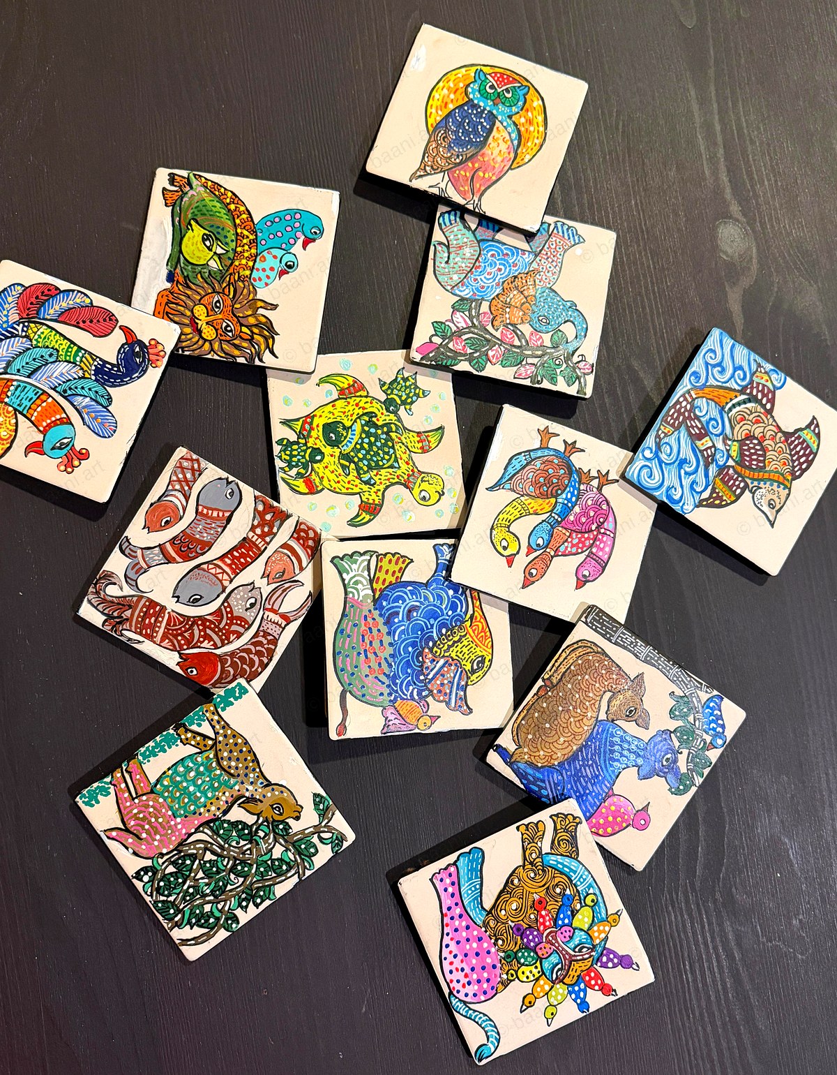 Gond Art — set of hand-painted ceramic coasters, each a different creature in vibrant rhythmic pattern